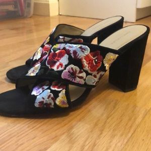 Black heeled sandals with floral straps